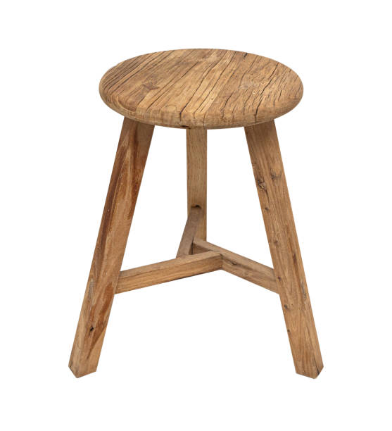 istock Old wooden stool three legs isolated 2135686904