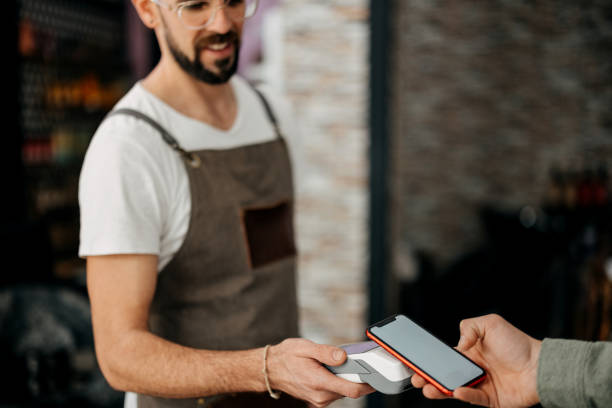 istock Contactless payment at the barbershop 2135692298