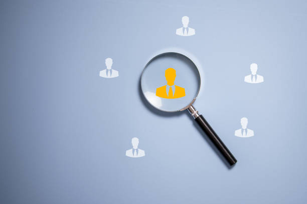 istock Human icon inside vintage magnifying glass for focus business objective on blue background and copy space, human development recruitment leadership and customer target group concept. 2135718659