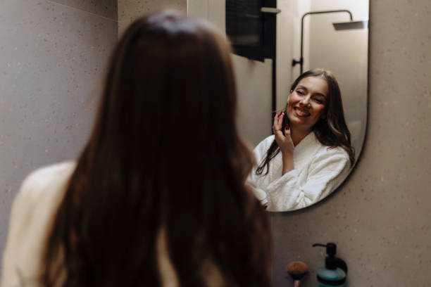 istock Woman applying moisturiser on face 2135720856