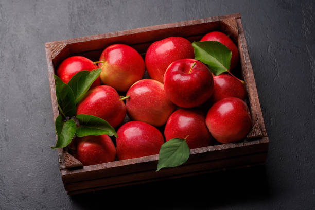 istock Wooden box with fresh red apples 2135770180