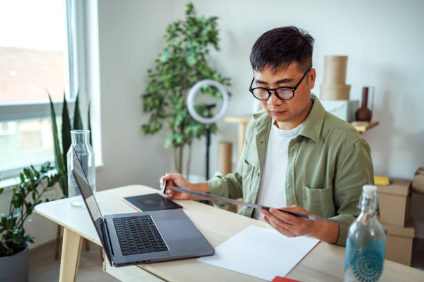 istock Casually clothed businessman working at small home office 2135781745