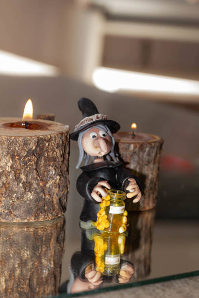 Halloween decoration with candles and witch stock photo