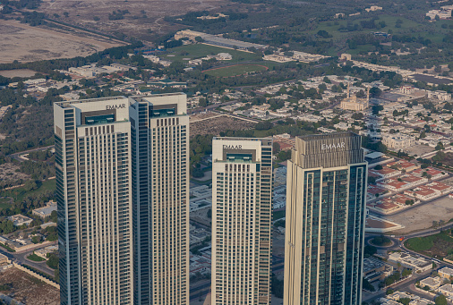 Dubai, United Arab Emirates - November 7, 2023: A picture of four Emmar apartment buildings next to each other.