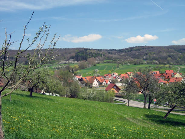 istock A panoramic view of a small village with fields and hills with a forest. A beautiful landscape of village life 2135831462