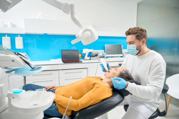istock High qualified dentist using portable dental scanner to capture every detail 2135833222