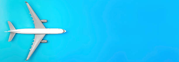 istock Airplane on a blue background, flat lay, travel concept. 2135837532