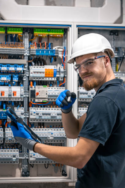 istock Happy bearded technician in protective helmet with digital tablet. 2135846548