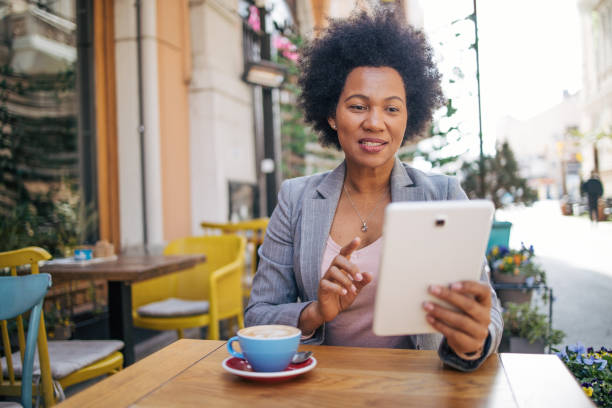 istock Woman having a video call at the cafe 2135849723
