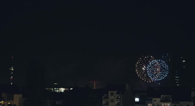 Grandiose big salute fireworks on background of night city
