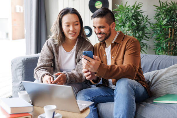 istock A positive work culture - a man and a woman using wireless technology 2135872582