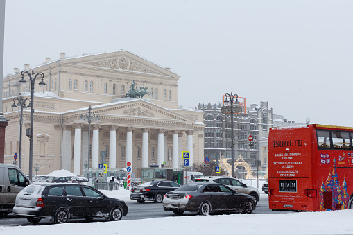 View of the building of the Bolshoi Theater and Teatralny Proezd Street in a winter day. Moscow, Russia, February 13, 2021.