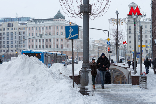 Tverskaya street after heavy snowfall, entrance to the Pushkinskaya metro station. Moscow, Russia, February 13, 2021.