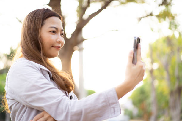 istock Woman using smartphone for messaging and video calling. 2135924634