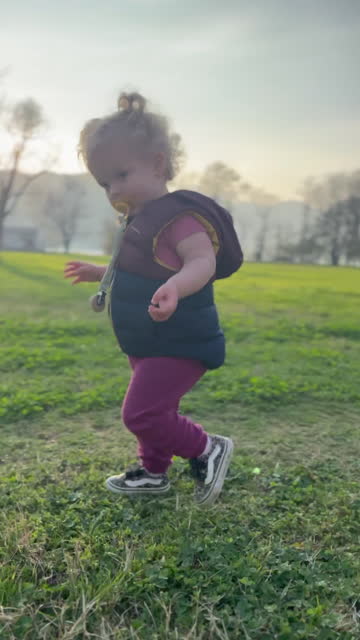 Baby toddler girl learning to walk