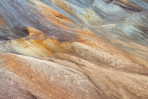 Striking natural color palette sweeps across Tunupa Volcano's mineral-rich slopes