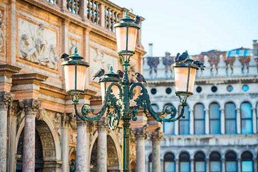 Old pink lantern at famous Piazza San Marco in Venice, Italy