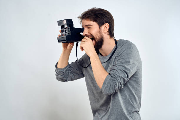 istock Male photographer professional camera work Studio Technology modern art light background 2136049479