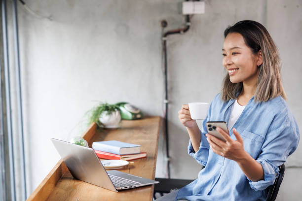 istock Young Chinese woman working in a Coworking space 2136086931