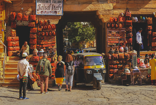 Jaisalmer, India- January 19, 2020 : Shops with Leather bags at Jaisalmer Fort entrance.