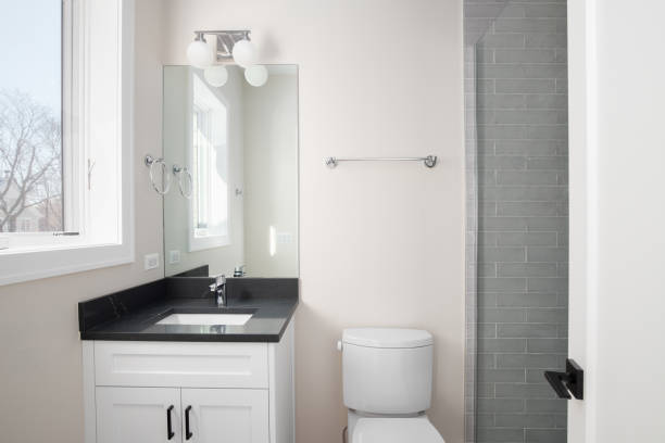 istock A bathroom with a white cabinet and black countertop. 2136124826