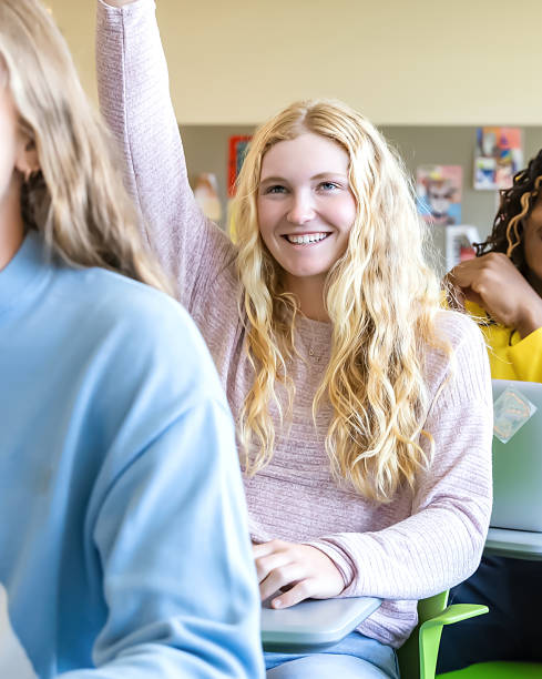 istock Diverse group of college students sitting in classroom 2136134570