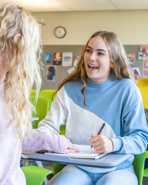 istock Diverse group of college students sitting in classroom 2136135088