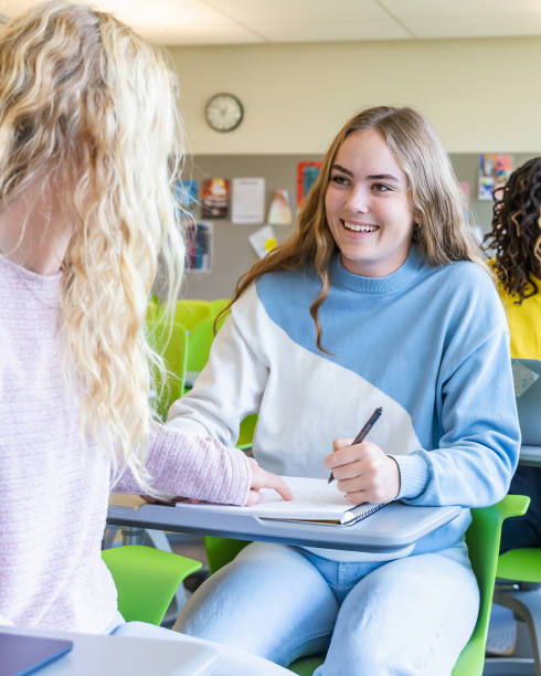 istock Diverse group of college students sitting in classroom 2136135089