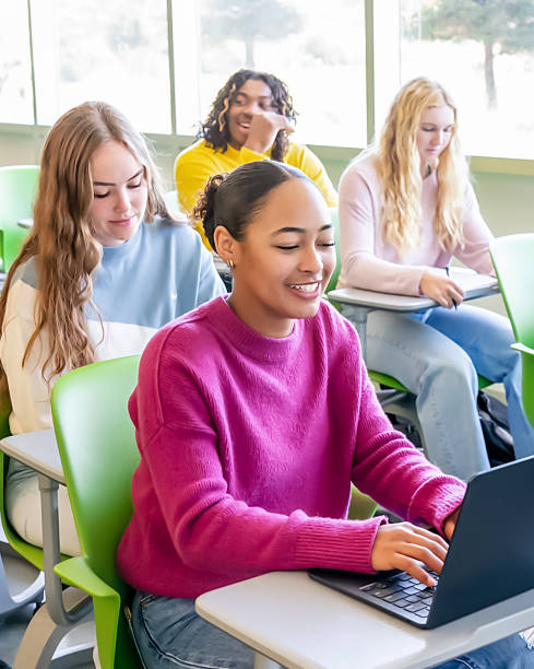 istock Diverse group of college students sitting in classroom 2136135093