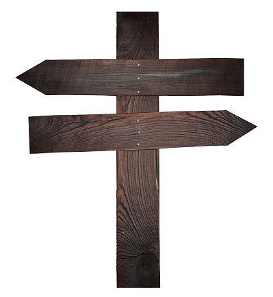 Wooden boards nailed together in the form of arrows on a pole, a direction indicator. Isolated background