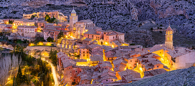 Panoramic night view of Albarracin - Medieval village in Aragon, Spain. Albarracin is a Spanish town, in the province of Teruel, Autonomous Community of Aragon. Albarracin has an elevation of 1,182 m (3,878 ft) XXXL 42Mp outdoors photo taken with SONY A7rII and Zeiss Batis 40mm F2.0 CF