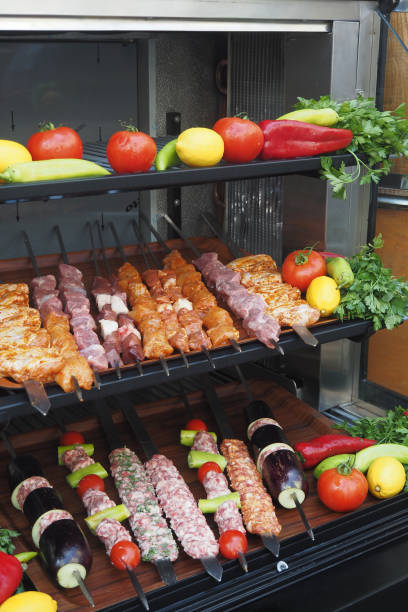 A tray of kebabs with meat and veggies a delicious dish on the table