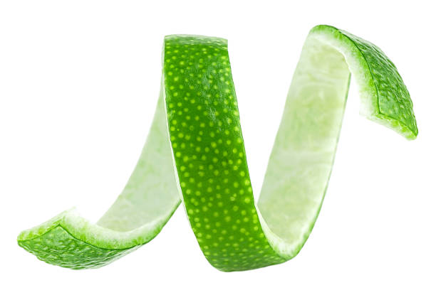 istock Lime peel twist isolated on a white background. Lime fruit peel or lime zest. 2136197210