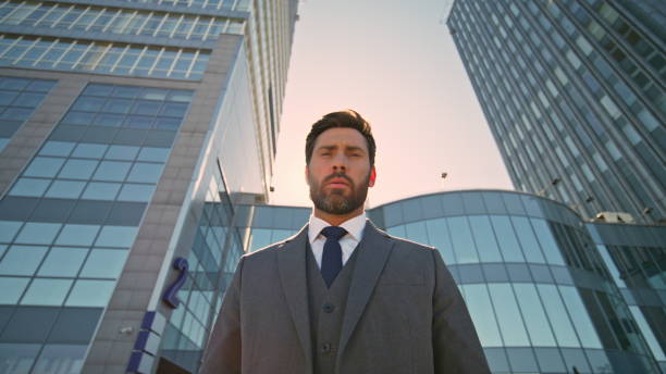istock Rich director posing downtown at evening sunlight close up. Serious businessman 2136238695