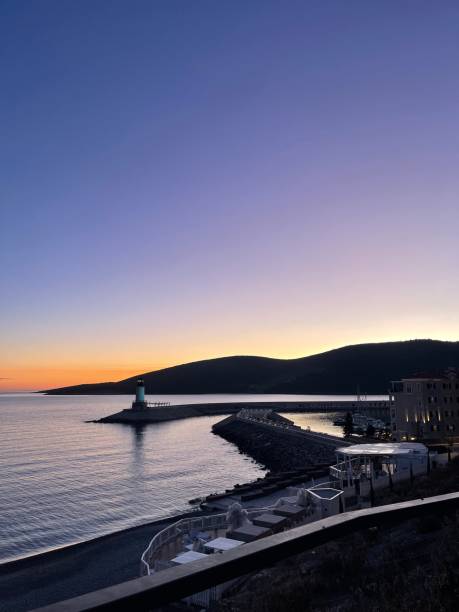 istock Lustica Bay lighthouse at sunset 2136240843