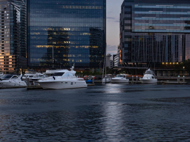 Melbourne's Yarra river, city skyline and boat reflections