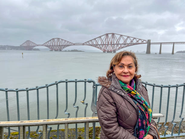 istock Senior Hispanic woman portrait at Forth Bridge Scotland 2136274341