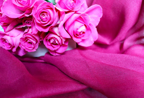 composition of red roses and red scarf