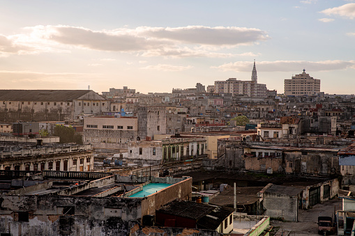 An areal  view looking over the roof tops of central Havana as the sun comes up in the morning.