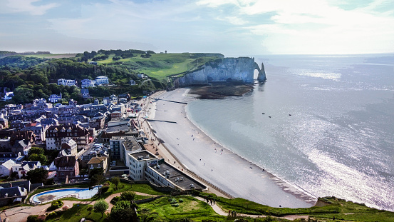 Aerial view on Etretat town  and bay and Falaise d'Avaln cliff  -sunny sunset in beautiful May day!