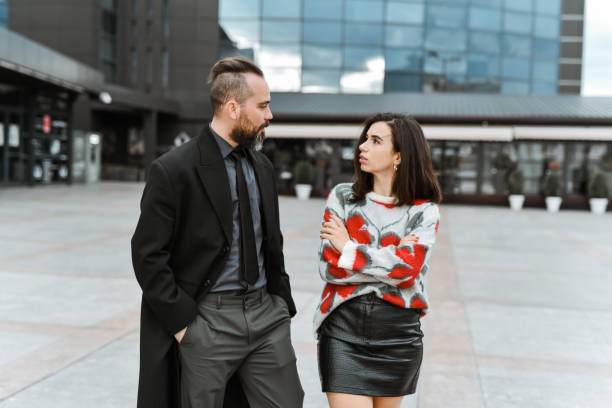 istock Businessman Taking Cute Female Out For A Walk 2136359393