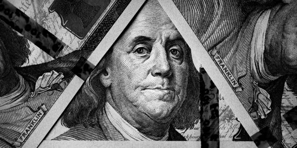 istock Benjamin Franklin's eyes from a hundred-dollar bill. The face of Benjamin Franklin on the hundred dollar banknote, backgrounds, close-up. 100 dollar bill with only eyes of Benjamin Franklin. 2136382649
