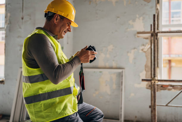 istock Photographer with a camera at the construction site 2136386290