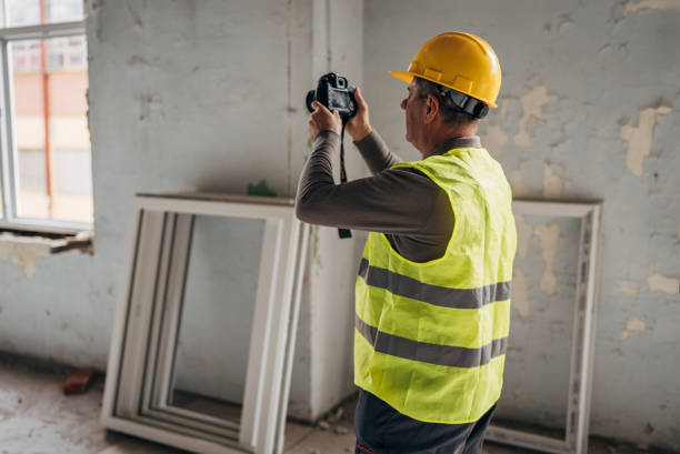 istock Photographer with a camera at the construction site 2136386804
