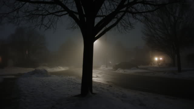 Dark street whit light at night with heavy fog