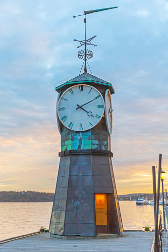 Oslo, Norway - October 30, 2016: Aker Brygge Clock Tower in Capital City at Dusk.
