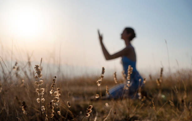 istock Woman praying to God on the mountain 2136430814