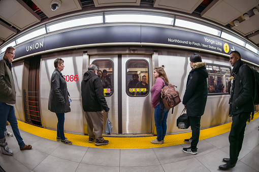 Toronto, Canada - April 1, 2024: Wide angle view of a subway train in the platform of Union Station.