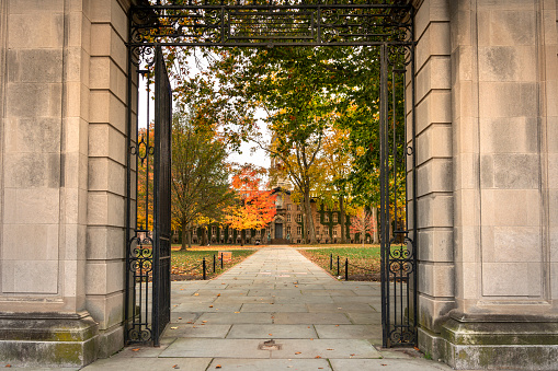 Princeton, New Jersey - October 28, 2022:  Entrance to Nassau Hall by the dormitories on the campus of the Ivy League university of Princeton.  Founded in 1746, the school is known for its engineering, science and humanities programs.
