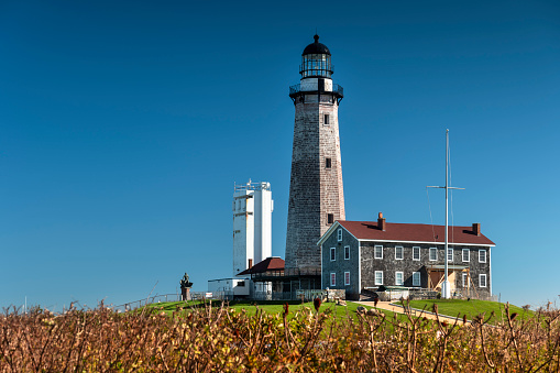 Montauk, New York - October 27, 2022:  Montauk Point Lighthouse Museum in the village of Montauk in The Hamptons Long Island.  The historic 1796 lighthouse was authorized under President George Washington.
